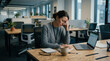 © SEKAR - Woman Experiencing Stress While Working in Modern Office Environment Under Bright Lights