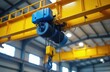 © Viktor - Overhead crane hoist mechanism with yellow beam structure in industrial warehouse. Heavy machinery part used for lifting and moving large objects in factory. Engineering equipment.