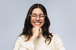 © Jacob Lund - Woman with glasses laughing and resting chin