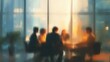 © Rafi - Silhouetted business people in a sunlit room, meeting around a table
