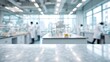 © Ameliaa - Blurred laboratory scene with scientists in white coats working at workstations