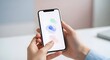 © Lambe - Smartphone user touching screen with colorful abstract shapes