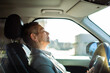 © Davor - Mature woman resting in driver's seat of parked car