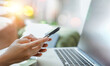 © Anchalee - Person use smartphone and laptop used for email management,Customer communication,Online workflow,business productivity,Mobile connectivity,Digital communication,Remote work,Secure information access