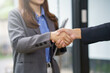© Crystal - Business partners shaking hands, concluding an agreement or job interview. Concept of successful teamwork, collaboration, and trust
