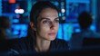 © RB 4k Photo  - Woman looking at computer screen with blue lit background and coworkers