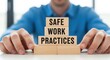 © Nosuya - Safe work practices concept with wooden blocks and hands