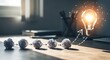 © MSTMAYA - Creative business process showing crumpled paper balls evolving into a glowing light bulb idea on a wooden office desk with soft lighting