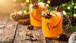 © bashkirovaphoto - Mulled apple cider with cinnamon, star anise, apple slices in clear mugs. Rustic wood table. Cozy, festive winter holiday beverage.