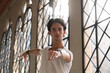© Niyaz Tavkaev/Stocksy - Male dancer spinning around against window