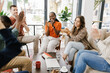 © Mihajlo Ckovric/Stocksy - Team Meeting in a Modern Cafe With Discussions and Applause