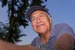 © NAILOTL MENDEZ/Stocksy - Smiling older hispanic farm worker looking up