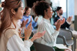 © Jovo Jovanovic/Stocksy - Diverse audience applauds at a conference or presentation.