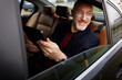 © Studio Firma/Stocksy - Backseat smile
