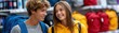 © Wonderful Studio - Teen student backpack retail store aisle back to school shopping with smiling teen student couple choosing backpack inside retail store aisle with