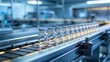 © Diane - Glass vials on conveyor belt in factory