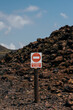 © VICTOR TORRES/Stocksy - Prohibido el paso sign on volcanic lava field, La Palma