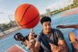 © VICTOR TORRES/Stocksy - Basketball players practicing skills on outdoor court