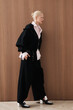 © Serge Filimonov/Stocksy - Fashion portrait woman walking in studio