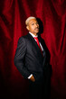 © Tania Cervian/Stocksy - Man in suit with red tie