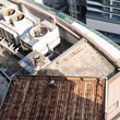 © SY Atelier/Stocksy - Industrial Rooftop Ventilation System in Soft Afternoon Sunlight