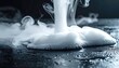 © SARIFUDIN - Swirling white vapor flows onto a dark, glossy surface, creating a dreamy effect