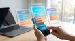© Sadia - Hands holding smartphone with saas pricing subscription plans floating above screen near laptop on wooden desk in modern office