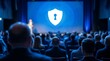 © haemye - Attendees listening to a business presentation featuring a glowing blue keyhole shield icon, concept for data protection workshops, cybersecurity training and corporate seminars