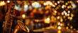 © petrrgoskov - Golden saxophone in foreground of elegant restaurant interior with warm bokeh lights, live jazz music atmosphere, romantic evening and luxury entertainment concept.