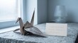 © SyafiqRizal - Origami Crane With 'Well-being' Text on Textured Surface
