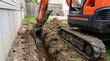 © ENDRY - Mini Excavator Digging Trench for Home Construction.