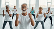 © SYATRI RAWU - Group of energetic diverse senior people in sportswear doing aerobics workout in bright gym studio, focusing on healthy lifestyle and vitality.
