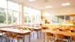 © rahwik - Beautiful blurred background of bright classroom and study room with panoramic windows and beautiful lighting. Blurred school classroom without students with empty chairs and tables.