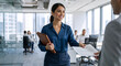 © Vyatcheslav - Professional woman handing document to colleague in modern office. Smiling businesswoman with leather portfolio in corporate setting. Teamwork and collaboration concept