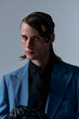 © Bliss - Stylish young man poses confidently in a modern studio setting