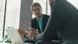 © opolja - Businessmen discussing deal, sharing startup ideas, business partners negotiations or job interview in modern office