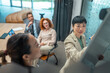 © Miljan Živković - Businesswoman presenting strategy to colleagues during office meeting