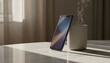 © antuanetto - Smartphone propped against coffee mug on a marble table in warm morning sunlight, representing a mindful start and digital lifestyle concept