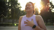 © ChayTee - Asia young Gen Z people mindful happy woman open arm relax body deep stress relief outdoor nature green public park sun light self love anti aging life asian female mental health care modern medical.