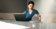 © peopleimages.com - Nurse, paperwork and woman with laptop in clinic, administration or reading medical records on web. Healthcare, information and asian person with tech for test results, documents or hospital research