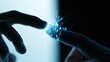 © Armin - Two fingers touch, creating a burst of digital blue light particles