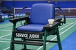 © Fotograf - A blue chair with a tennis racket on top