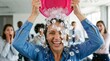 © Olga Ко - Broken ac office funny workplace concept: overheated businesswoman pouring a bucket of ice over her head to cool down during an extreme summer heatwave in the office.
