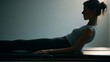 © progressman - Person performing abdominal workout in low light