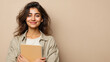 © AI_Vision - Smiling student girl holding notebook looking optimistic