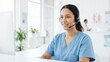 © CK Studio - Healthcare professional providing customer service with headset in bright clinic office for patient support or telehealth assistance
