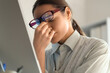© Pixel-Shot - Tired female trader in eyeglasses at office, closeup