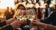 © Sajal.savar - Cheers to summer friends toasting with refreshing white wine at golden hour gathering