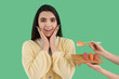 © Pixel-Shot - Surprised young woman and female hands with sushi on green background