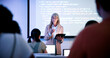 © peopleimages.com - Professor, students and presentation with tablet in classroom, programming course and IT curriculum. University, people or mature lecturer with software algorithm for coding lesson, education or tech